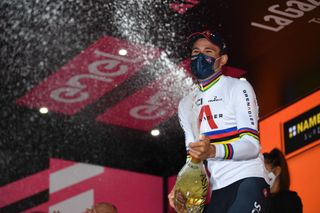 VALDOBBIADENE ITALY OCTOBER 17 Podium Filippo Ganna of Italy and Team INEOS Grenadiers World Champion Jersey Celebration Champagne Mask Covid safety measures during the 103rd Giro dItalia 2020 Stage 14 a 341km individual Time Trial from Conegliano to Valdobbiadene 254m ITT girodiitalia Giro on October 17 2020 in Valdobbiadene Italy Photo by Tim de WaeleGetty Images