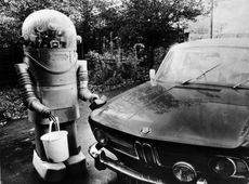 This old-timey robot is cleaning a car, replacing the simple workers of yesterday. 