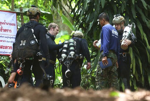 International rescuers team prepare to enter the cave where a young soccer team and their coach trapped by flood waters Thursday, July 5, 2018, in Mae Sai, Chiang Rai province, in northern Th