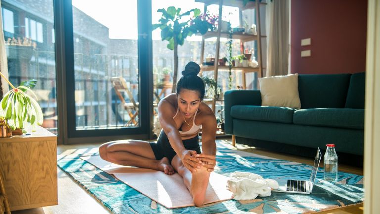 Woman doing yoga at home, exercises for better sex