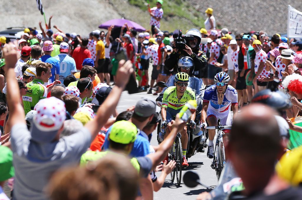 Thibaut Pinot and Rafa Majka ride through the crowds at the top of the Col du Tourmalet where Pinot won the Souvenir Jacques Goddet