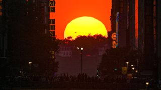 A view of the sunset from 42nd street during the 'Manhattanhenge' on May 29, 2023 in New York, United States. 