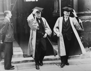 Wodehouse and friend in gown and mortar board in Oxford