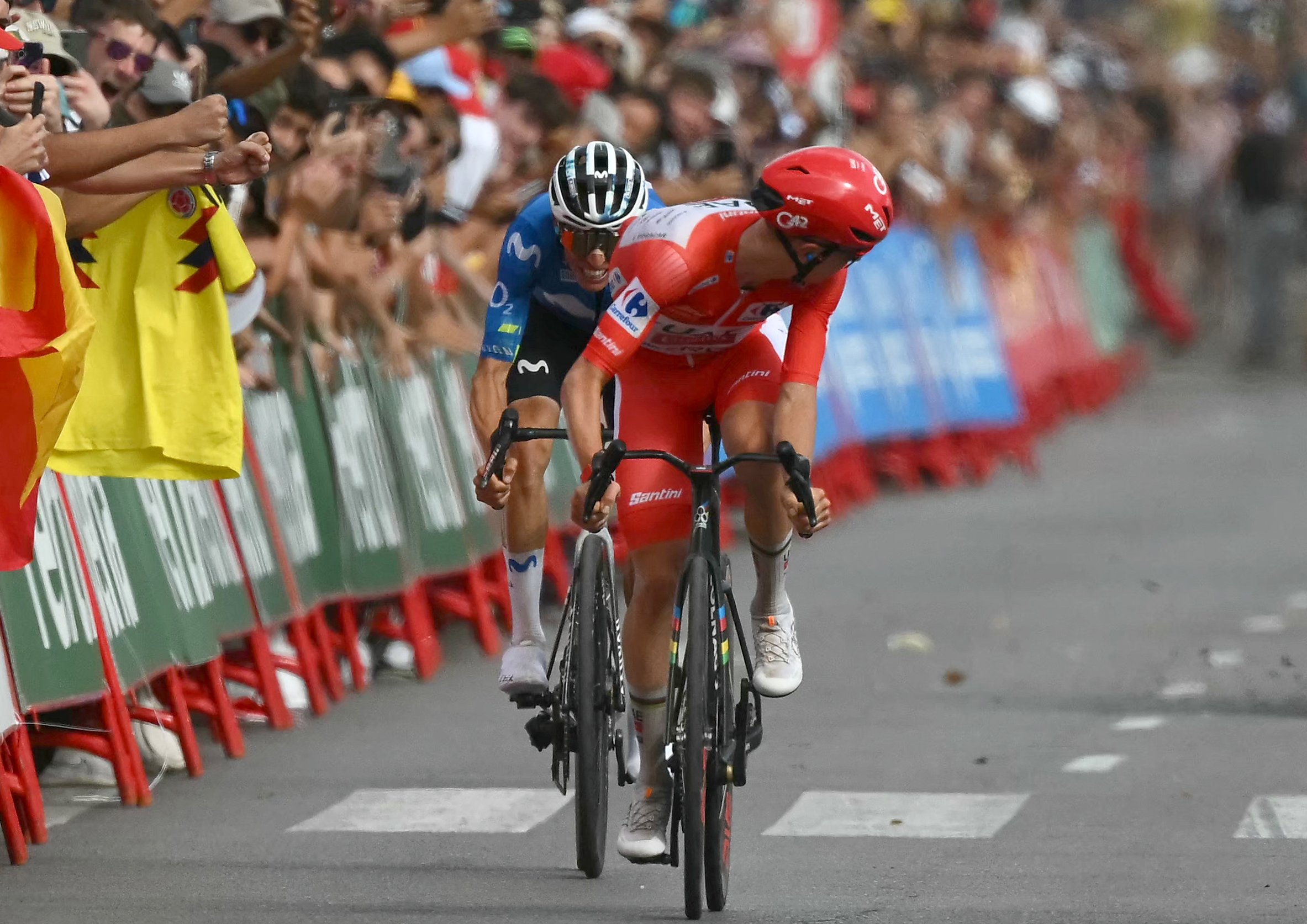 Pogacar looking back for chasers ahead of Enric Mas before the finish