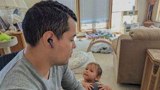 Our reviewer testing the EarFun Air S's noise cancellation in his son's play room