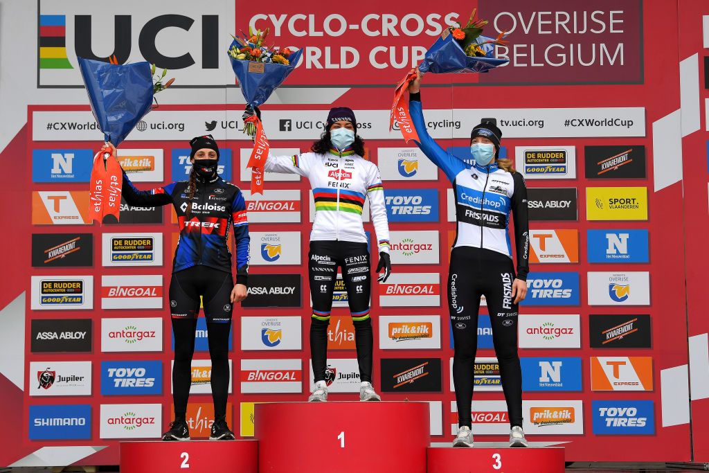 OVERIJSE BELGIUM JANUARY 24 Podium Lucinda Brand of The Netherland and Team Baloise Trek Lions Ceylin Del Carmen Alvarado of The Netherland and Team AlpecinFenix Manon Bakker of The Netherlands and Team CredishopFristads Celebration Flowers Mask Covid safety measures during the 61st Druivencross World Cup 2021 Womens Elite UCICX CXWorldCup Ostend2021 on January 24 2021 in Overijse Belgium Photo by Luc ClaessenGetty Images