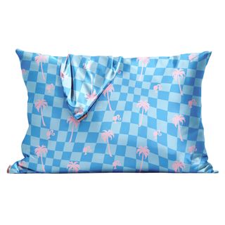 A blue checkered satin pillowcase with Barbie's silhouette in light pink throughout