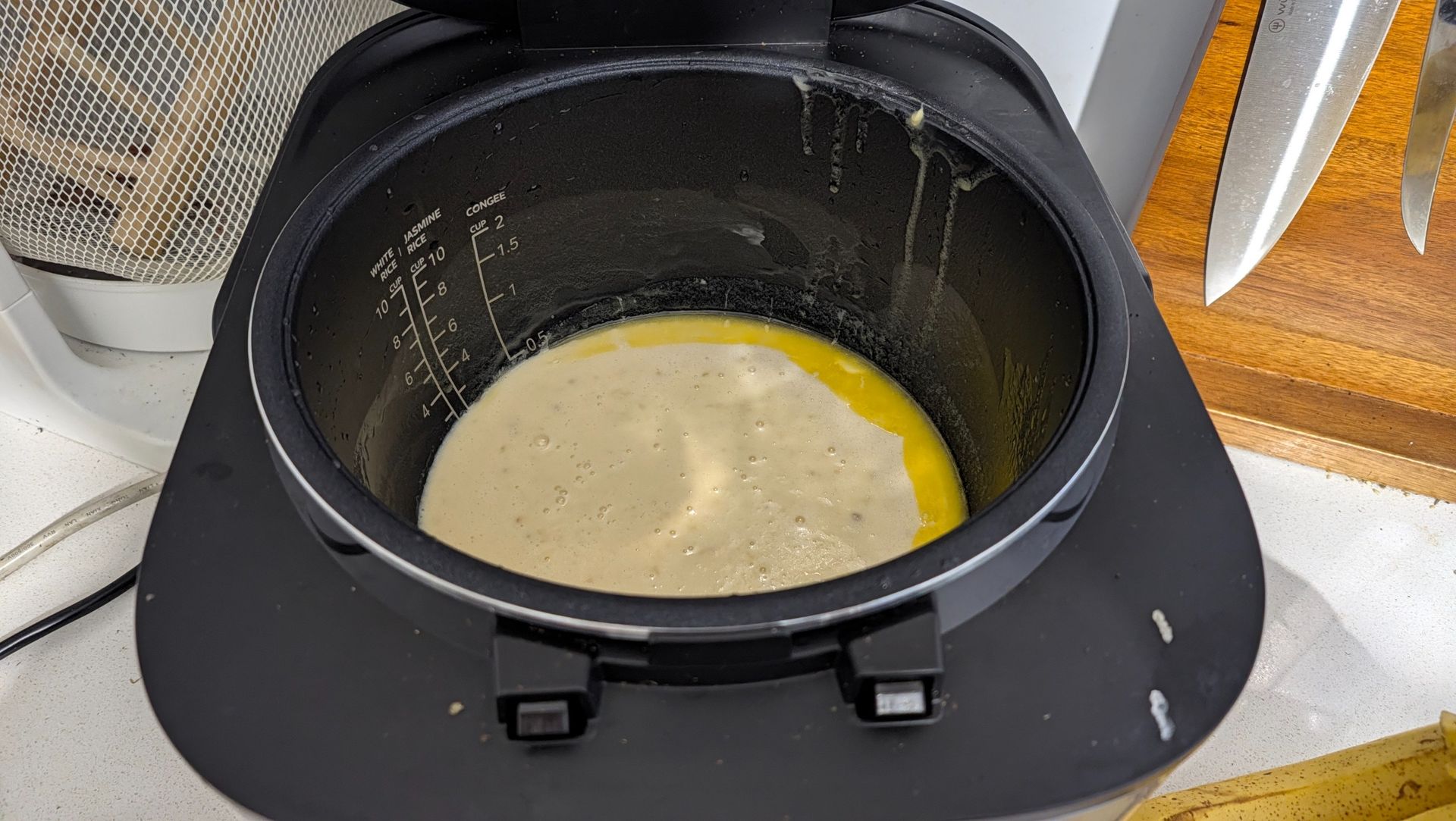 Midea 5L Induction Rice Cooker with banana bread batter in the inner pot before cooking