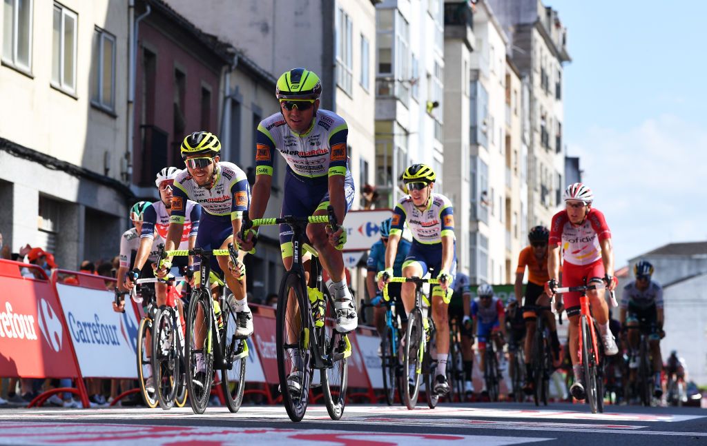 MONFORTE DE LEMOS SPAIN SEPTEMBER 03 Odd Christian Eiking of Norway and Rein Taarame of Estonia and Team Intermarch Wanty Gobert Matriaux cross the finishing line during the 76th Tour of Spain 2021 Stage 19 a 1912 km stage from Tapia to Monforte de Lemos lavuelta LaVuelta21 on September 03 2021 in Monforte de Lemos Spain Photo by Stuart FranklinGetty Images
