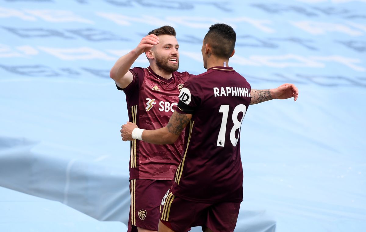 Stuart Dallas and Raphinha celebrate Leeds’ first goal against Manchester City