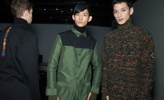 Male models wearing black, green and patterned jackets from the Kenzo AW15 collection