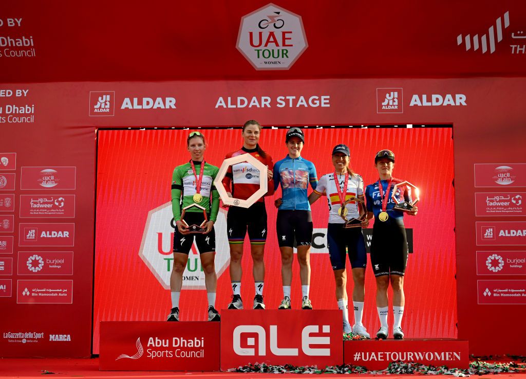 Podium of the 2024 UAE Women Tour (l-r): green points jersey Lorena Wiebes (SD Worx-ProTime), red leaders jersey Lotte Kopecky (SD Worx-ProTime), blue UCI Womens WorldTour young jersey and second overall Neve Bradbury (Canyon-Sram), third overall Mavi Garci (Liv AlUla Jayco) and stage 4 winner Amber Kraak (FDj-Suez)