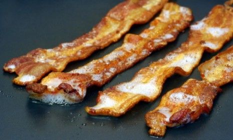 You may have to start limiting your bacon intake, as farmers have scaled down their pig herds to counter the skyrocketing costs of feeding the animals.