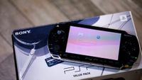 The PSP on top of its box