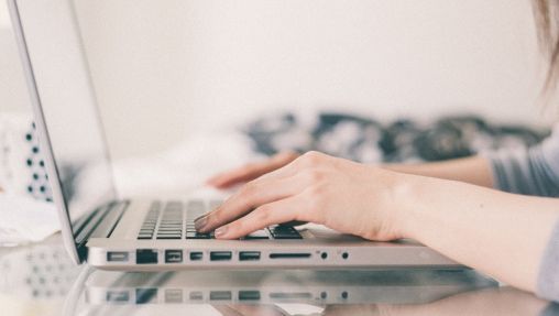 Woman typing on laptop