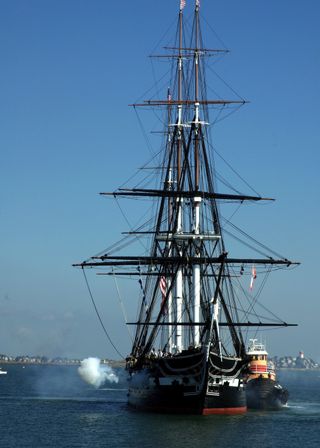 The USS Constitution fires her traditional 21-gun salute to the nation off Fort Independence at Castle Island during the ship's 217th birthday on Oct. 17, 2014.