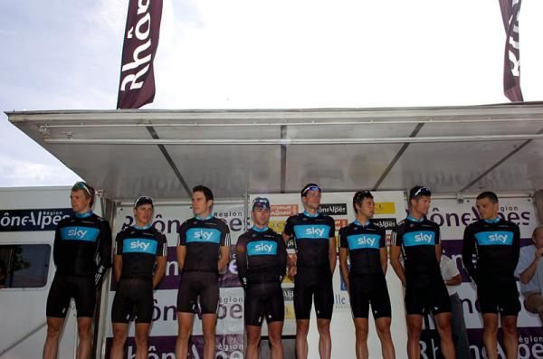 Team Sky riders line-up on stage for pre-race introductions.