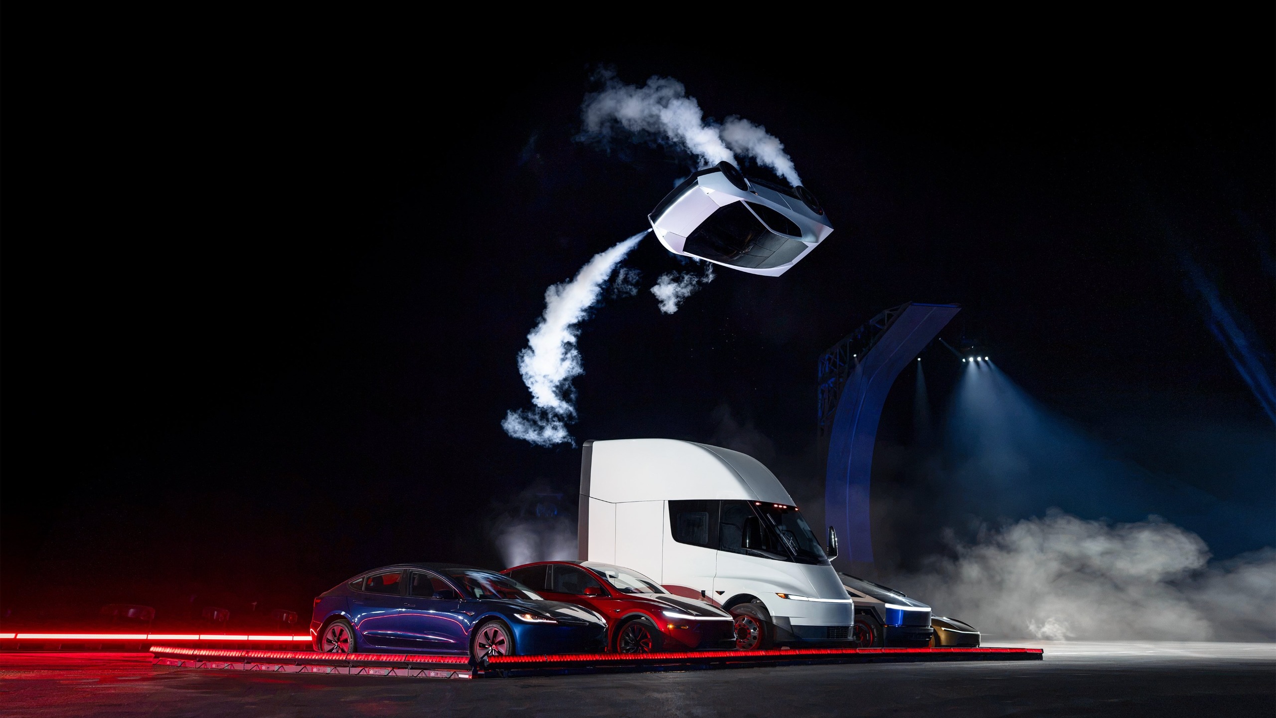 Tesla's next-gen, thruster-equipped Roadster launches itself over other vehicles during an unveiling event on Oct. 15, 2026.