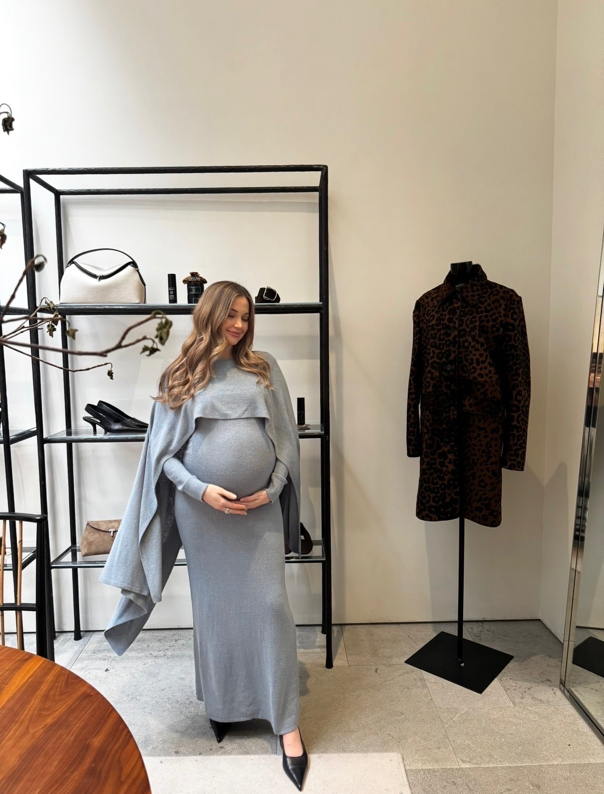 Photo of Elizabeth Grace Hand wearing blue toteme dress.