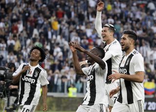 Juventus’ Juan Cuadrado, Cristiano Ronaldo, Blaise Matuidi and Emre Can celebrate at the end of a Serie A soccer match between Juventus and AC Fiorentina, at the Allianz stadium in Turin, Italy, Saturday, April 20, 2019. Juventus clinched a record-extending eighth successive Serie A title, with five matches to spare