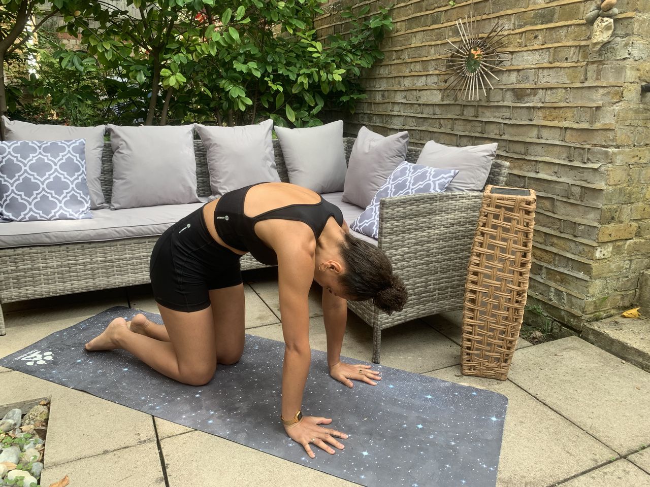 Yoga instructor Simone Venner demonstrates cat cow