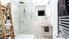 Bathroom with shower cubical and sink to support an expert guide of the best dehumidifier for a bathroom