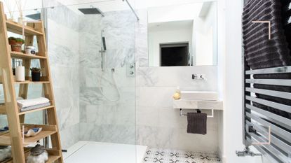 Bathroom with shower cubical and sink to support an expert guide of the best dehumidifier for a bathroom