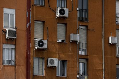 Air conditioners on building.