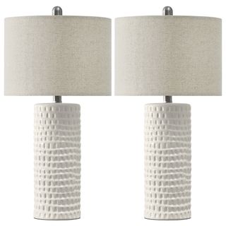 pair of white textured ceramic lamps with fabric shades