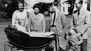 Photo taken on April 21, 1965 at Frogmore House in Windsor, Berkshire shows The British Royal Family: (from L to R) Princess Anne, Britain's Queen Elizabeth II, Prince Charles, Prince of Wales, Prince Philip, Duke of Edinburgh, Prince Andrew, Duke of York smiling at Prince Edward, Earl of Wessex, in his cradle