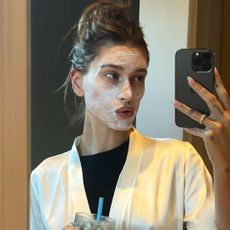 Hailey Bieber with a facial product on.