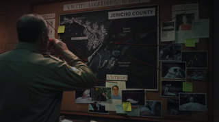 The Sheriff looking at a list of victims