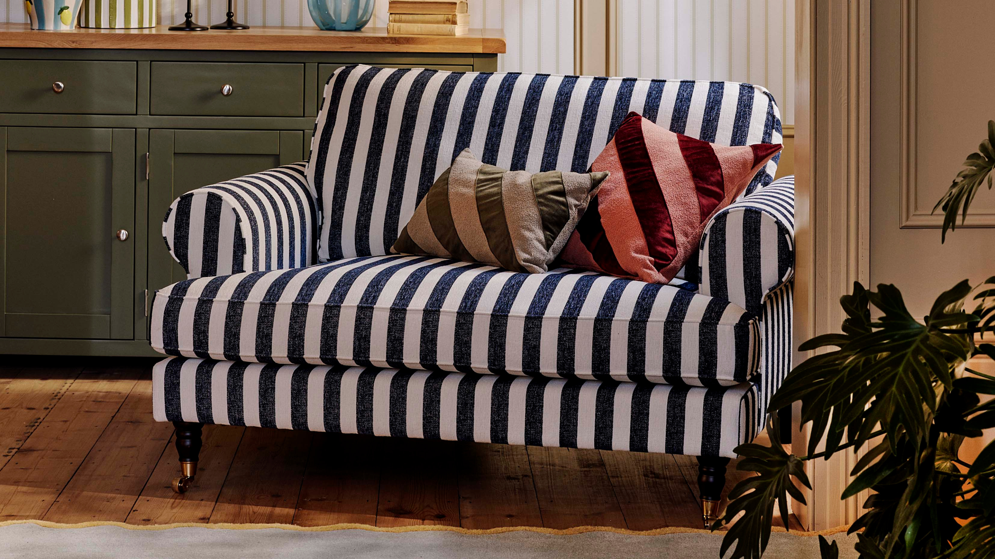 Coast Navy Striped Love Chair in a modern living room.