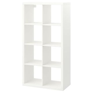 A white open shelving unit with square cubby holes