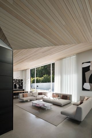 Living space in Vancouver house with angular ceiling, by Battersby Howat