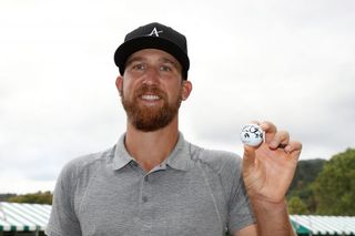 Kevin Chappell holds up his golf ball