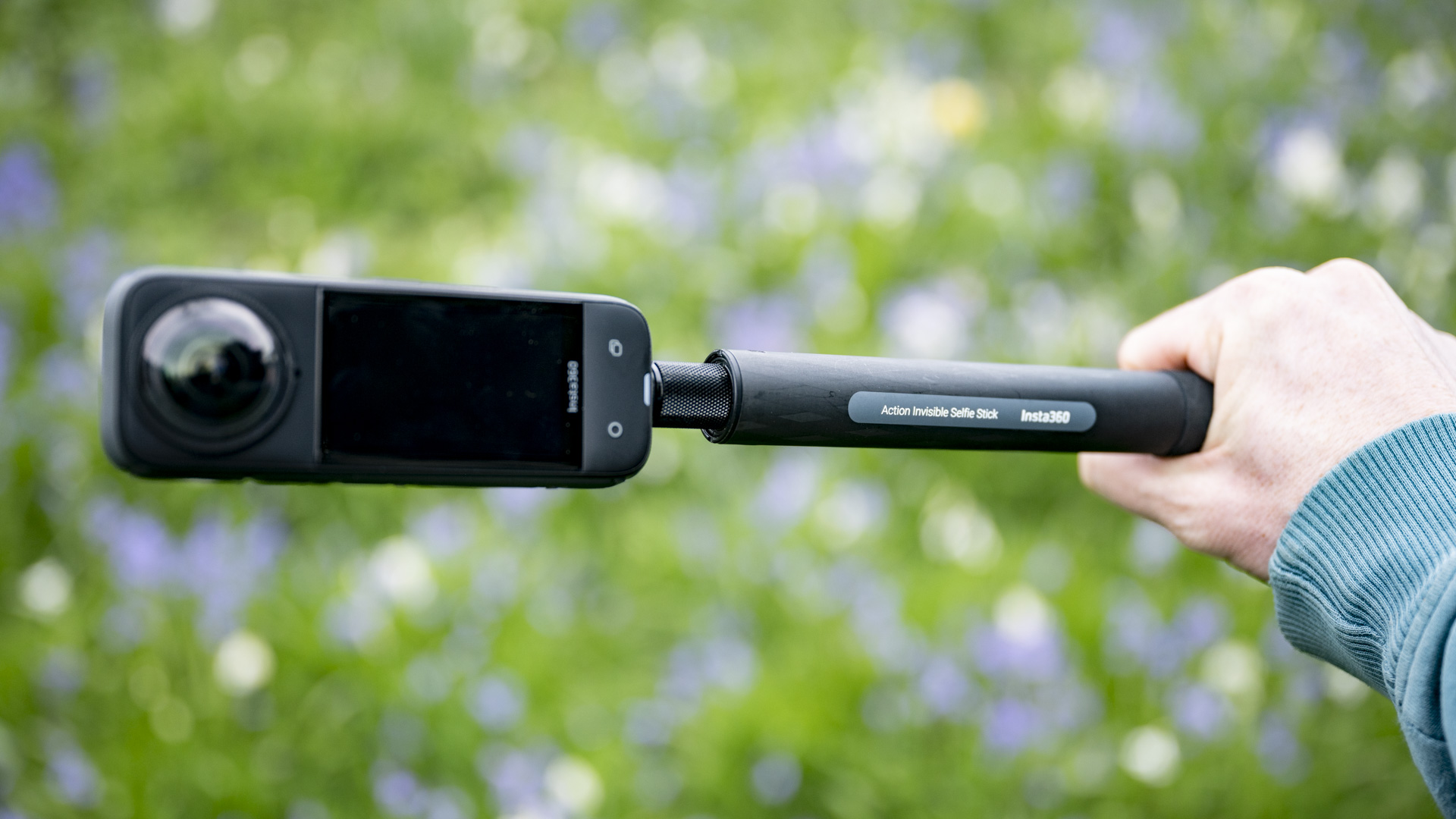 Insta360 X4 360 degree camera mounted to a selfie stick