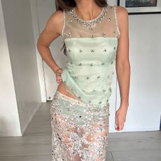 Woman in sheer skirt and sheer top