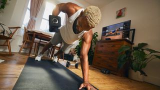 Man working out with the Peloton Guide