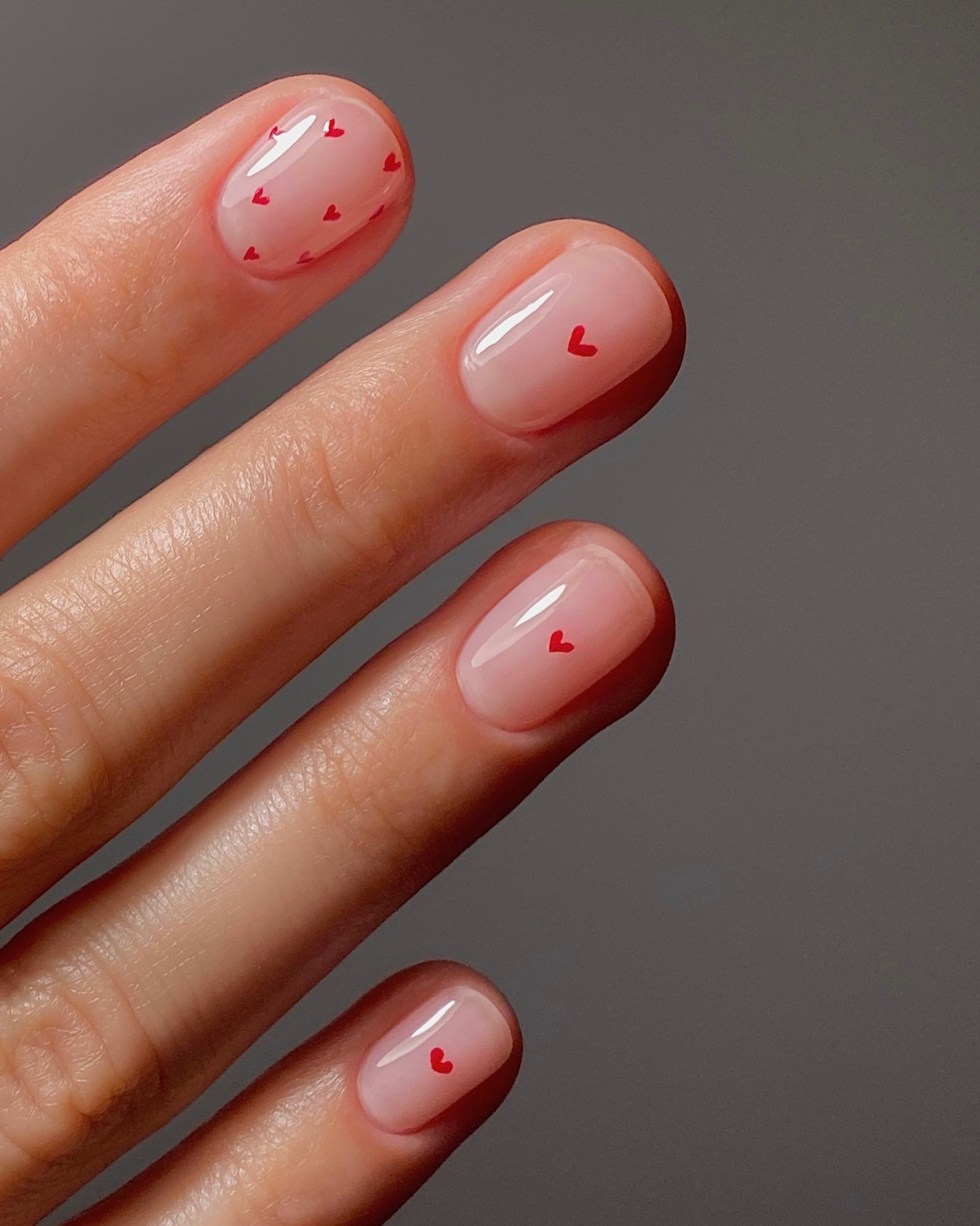 A close-up of micro heart nail art