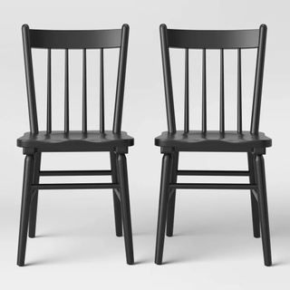 Two black dining chairs