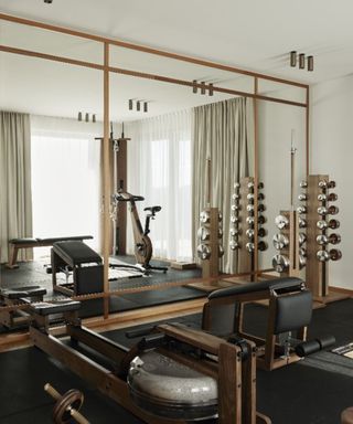 Home gym with mirrors and wood accents