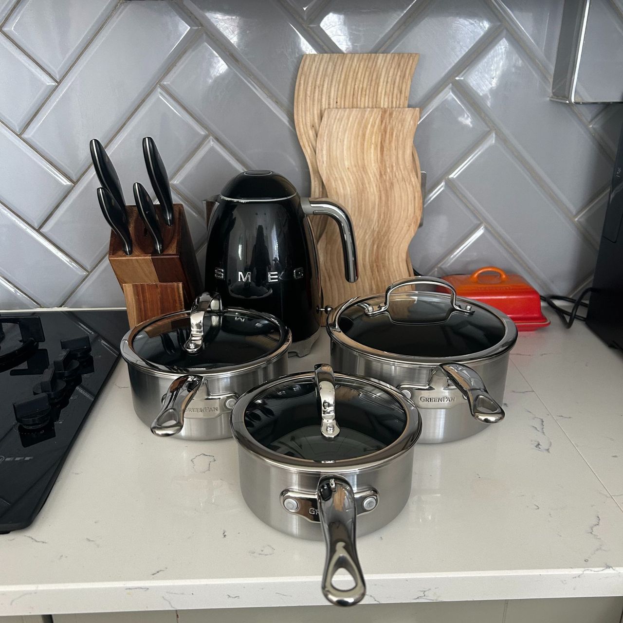 GreenPan Premiere Stainless Steel Ceramic Non-Stick Saucepan &amp; Lid Set, all pieces on kitchen worktop