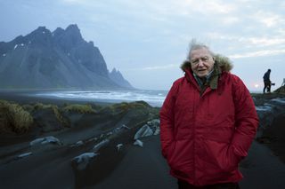 David Attenborough in red parka