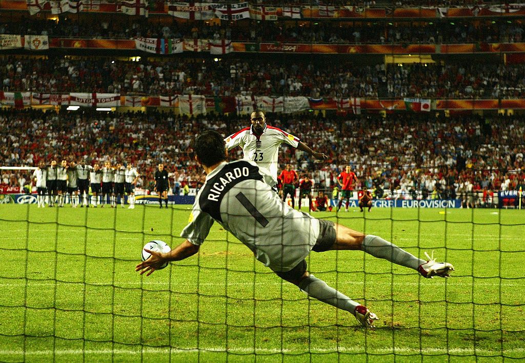 Darius Vassell of England has his penalty saved by goalkeeper Ricardo of Portugal during the UEFA Euro 2004 Quarter Final match between Portugal and England at the Luz Stadium on June 24, 2004 in Lisbon, Portugal. (Photo by Shaun Botterill/Getty Images)