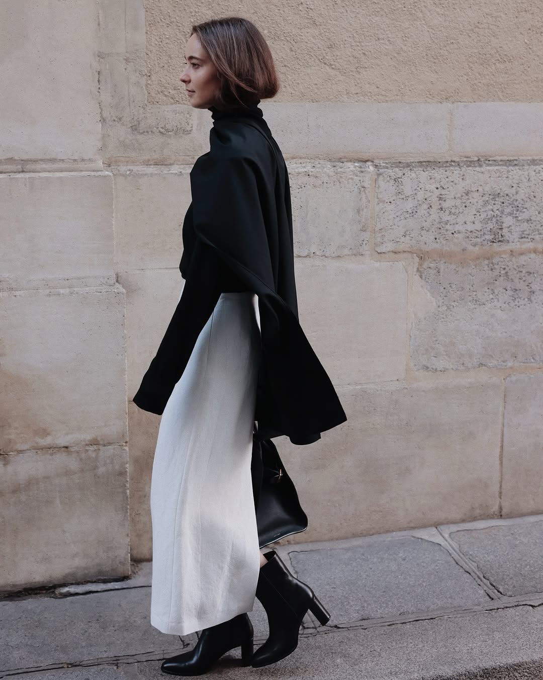 woman wearing black turtleneck outfit fall 2025