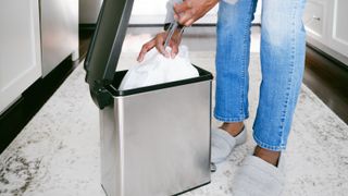 picture of woman emptying bin