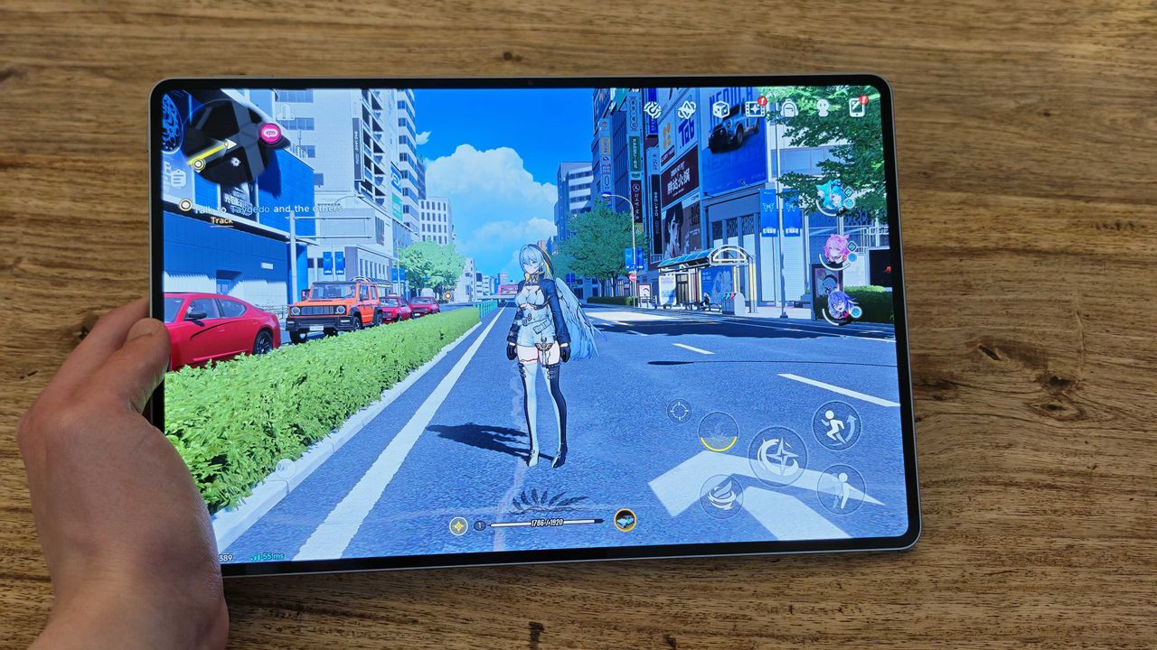 A photograph of the Honor MagicPad 4 in use on a wooden table.