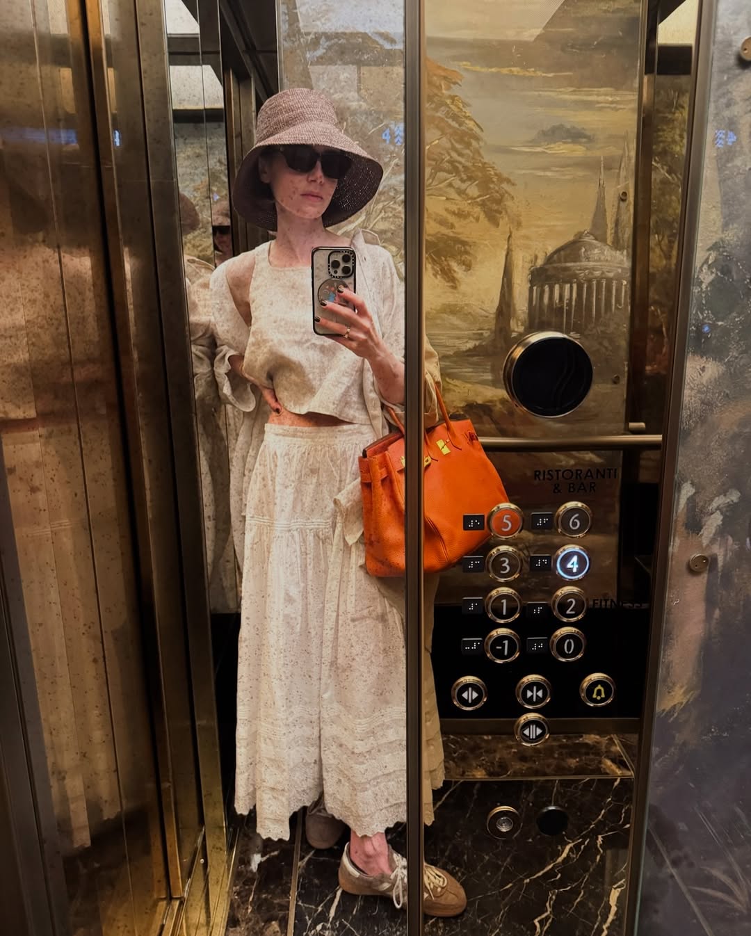 When in Rome, Lily Collins tapped into the brown sneaker trend with Adidas Spezials