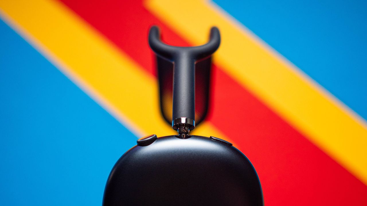 Apple AirPods Max 2 headset against a textured sheet showcasing the design